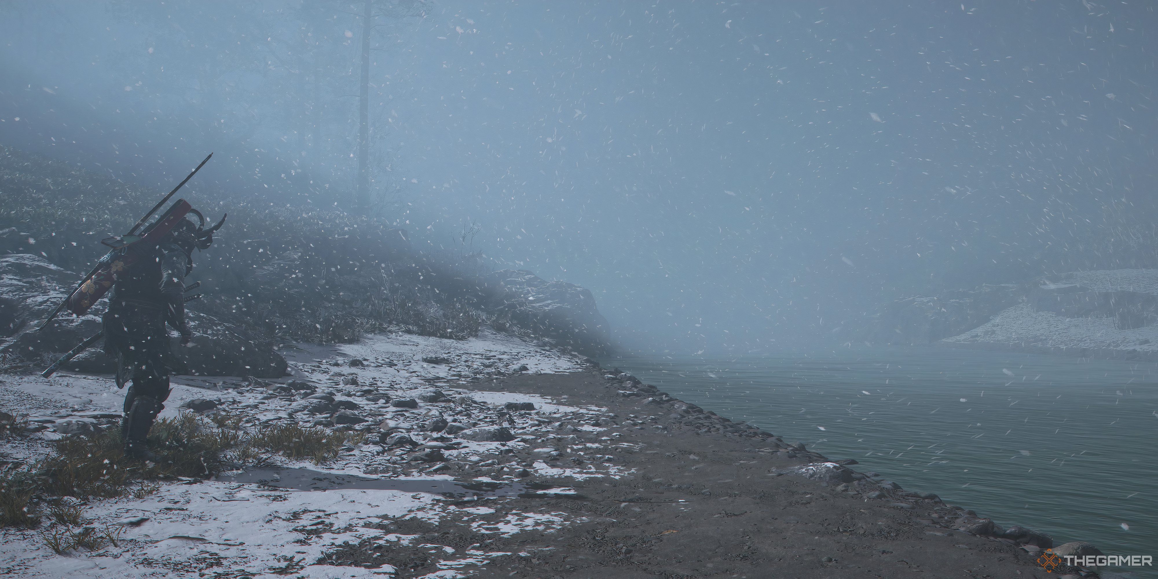 Assassin&rsquo;s Creed Shadows Yasuke in the snow looking at a river. There is snow on the ground and you cannot see infront of him.