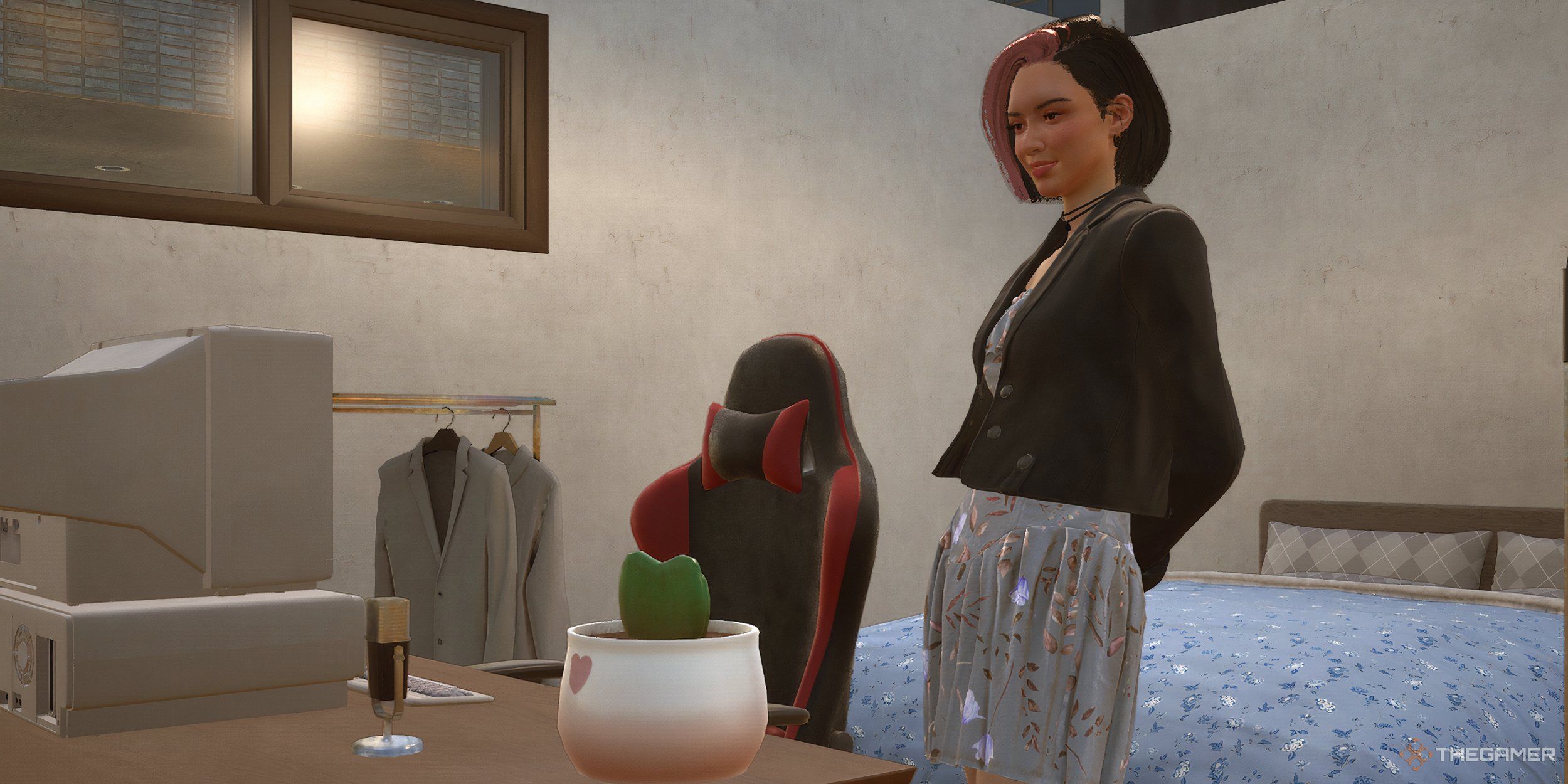 A woman staring at a potted cactus gift on her desk.