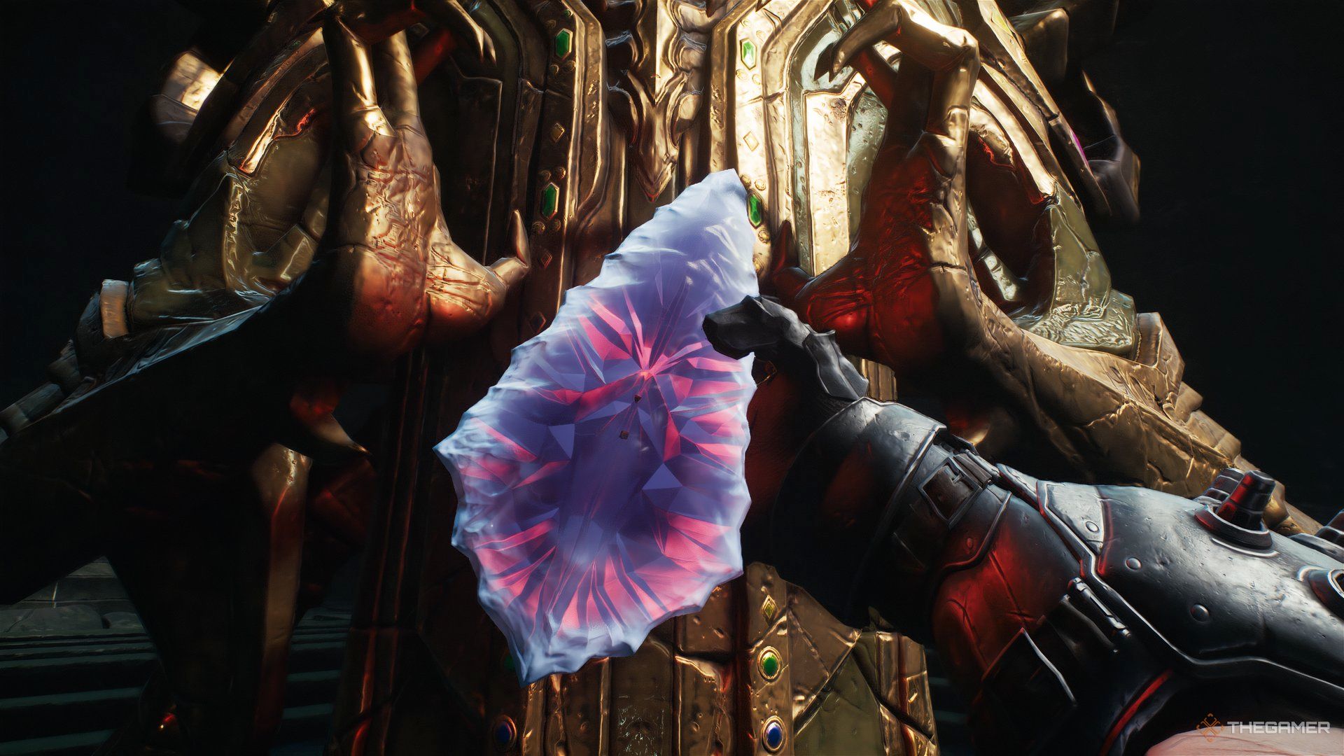 Doom Slayer taking the wraithstone from a statue in Doom: The Dark Ages.