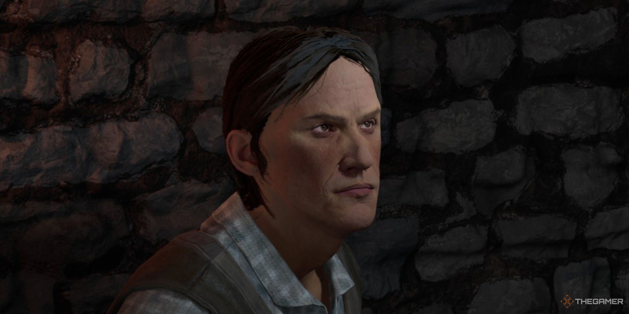 Player speaks to the grouchy, frowning Rowley Eardwulf at an inn in Oblivion Remastered.