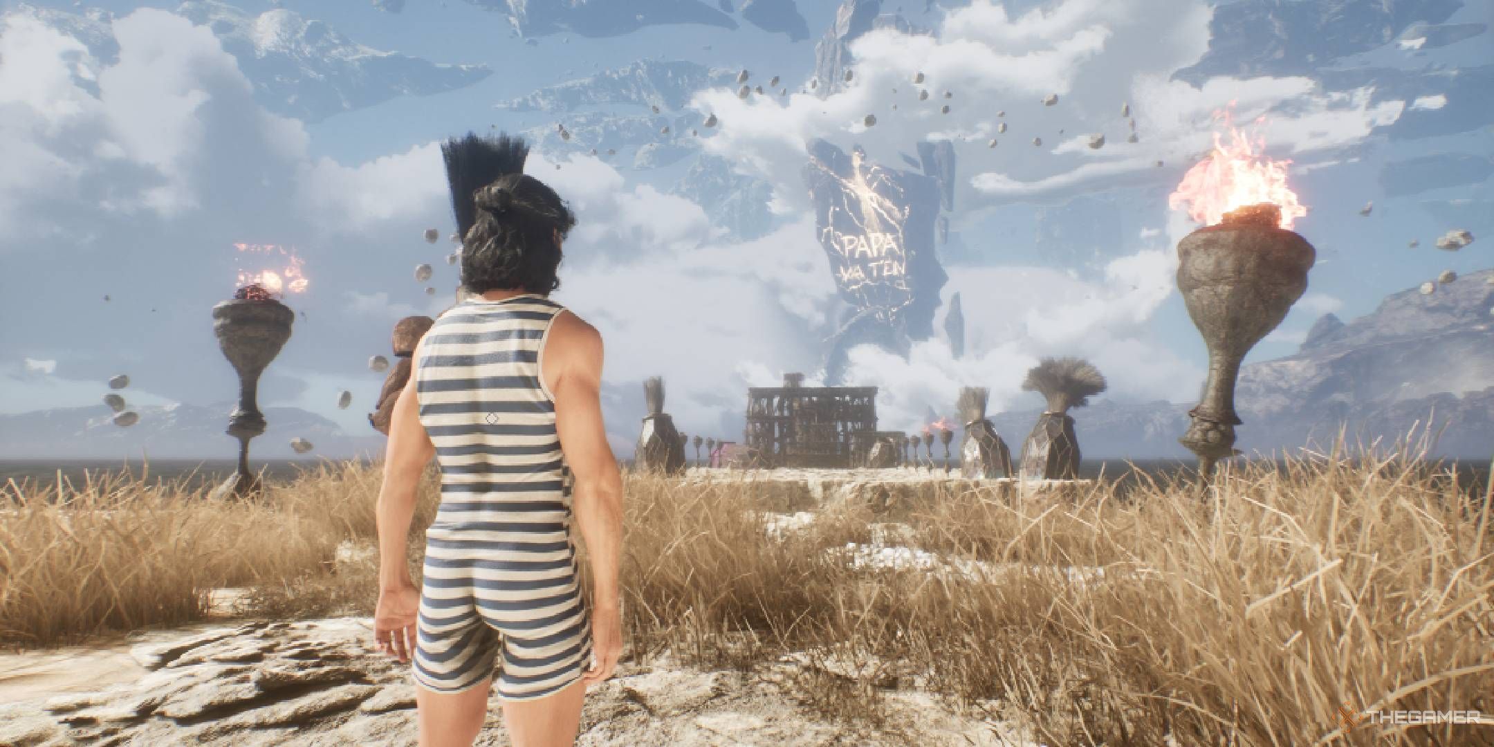 Verso in his swimsuit looking at the Papa Va T&rsquo;en grafitti on the Monolith in Clair Obscur Expedition 33.