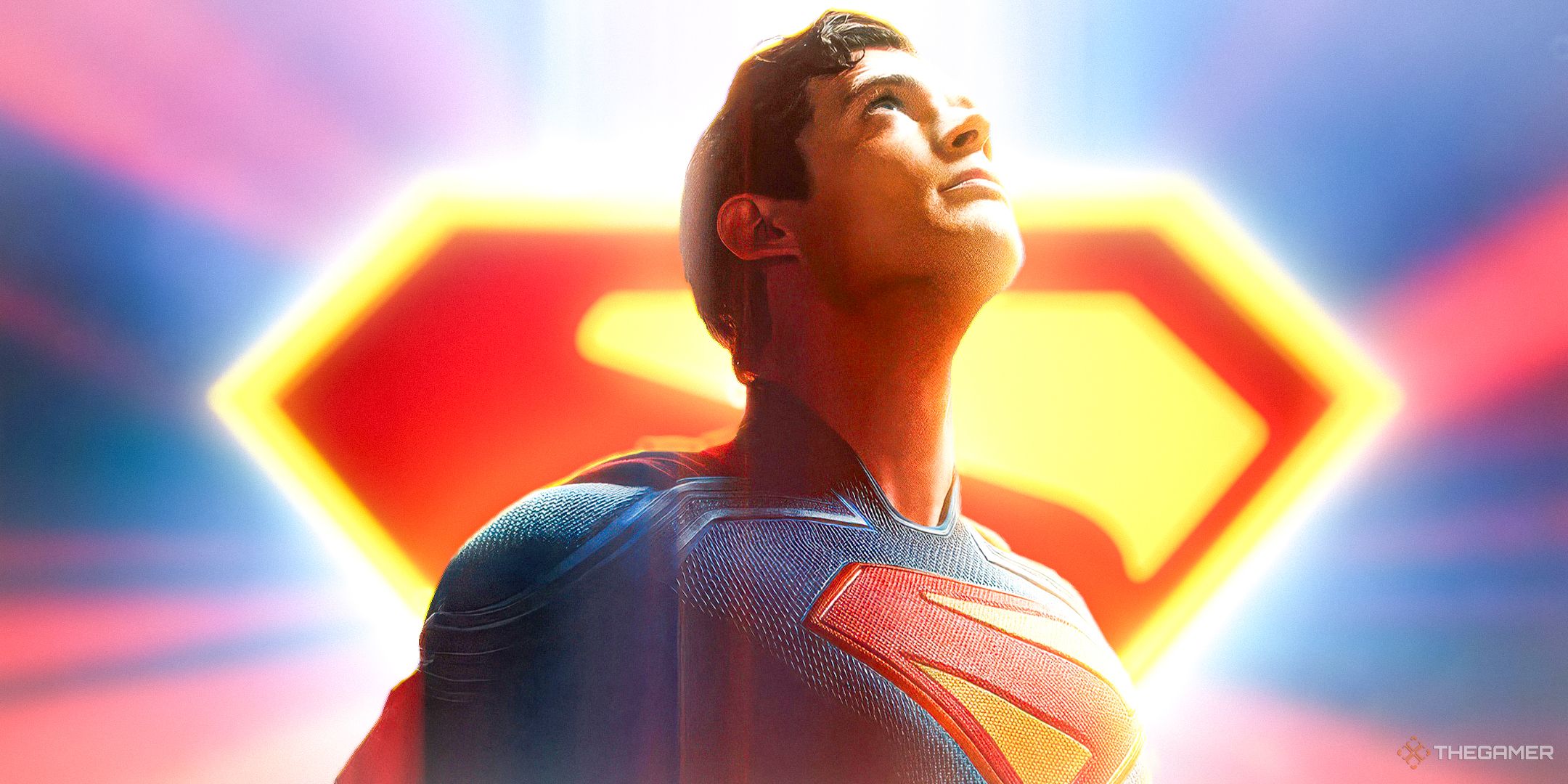David Corenswet as Superman, looking upwards. The Superman symbol is in the background.