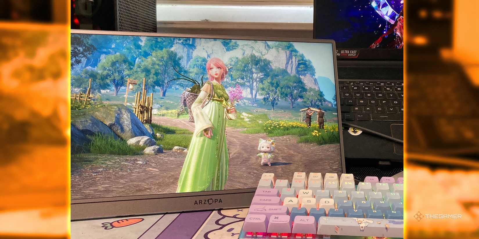 The Arzopa Z3FC portable monitor sits horizontally at the desk and has expanded the RGB keyboard.